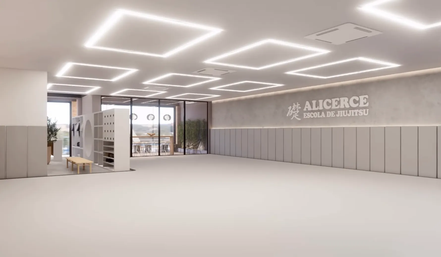 Tatame da nova sede Alicerce com iluminação geométrica e parede com o logo